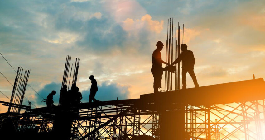 Silhouette of engineer and construction team working at site over blurred background sunset pastel for industry background with Light fair.Create from multiple reference images together.